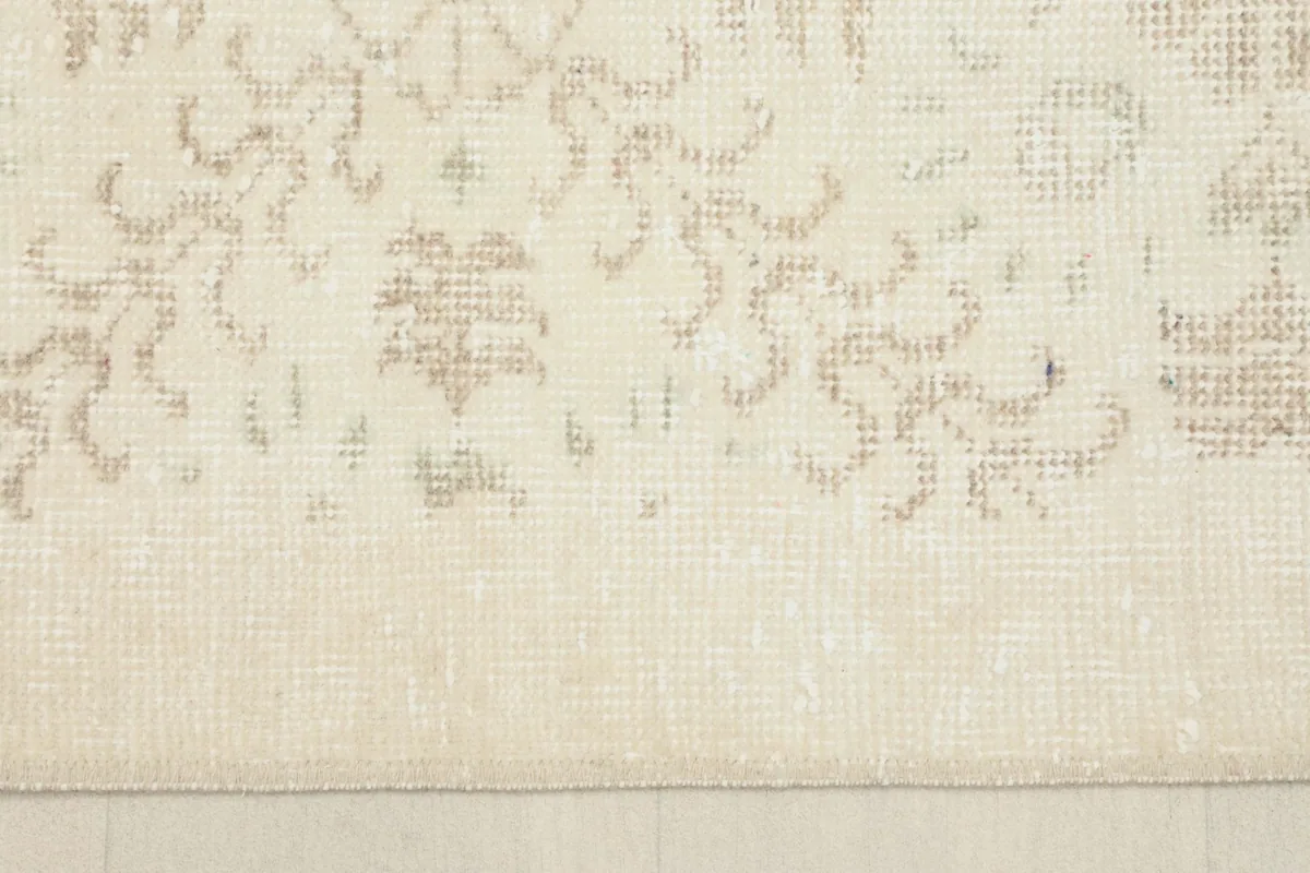 Close-up of the subtle border and main field of the vintage Anatolian runner, showing the low pile.