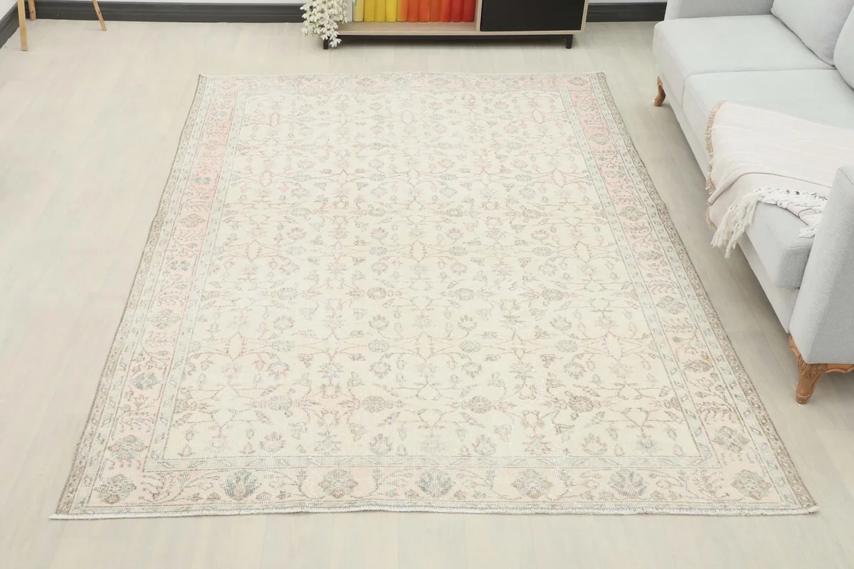 Overhead room view of the ivory floral Anatolian rug, providing a sense of its medium size and scale.