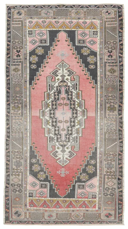 Full top view of the vintage rose and charcoal Anatolian area rug on a white background.