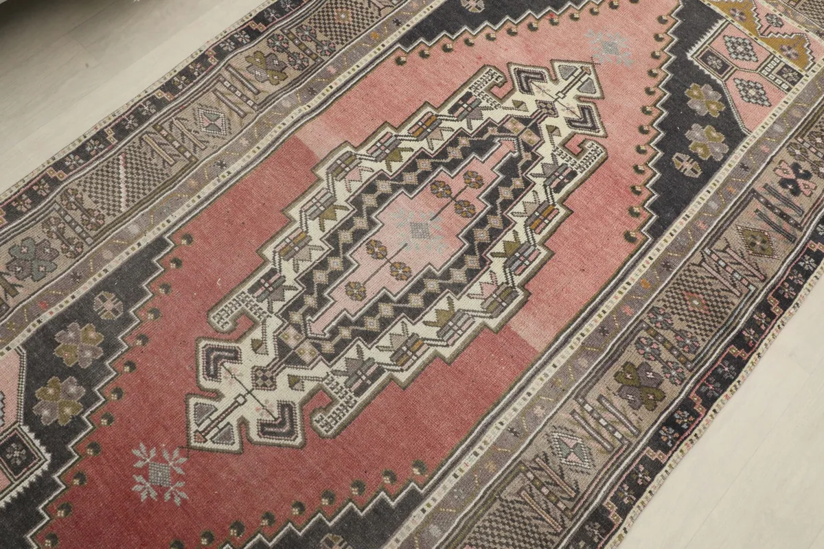 Overhead view focusing on the central geometric medallion and surrounding rose field.