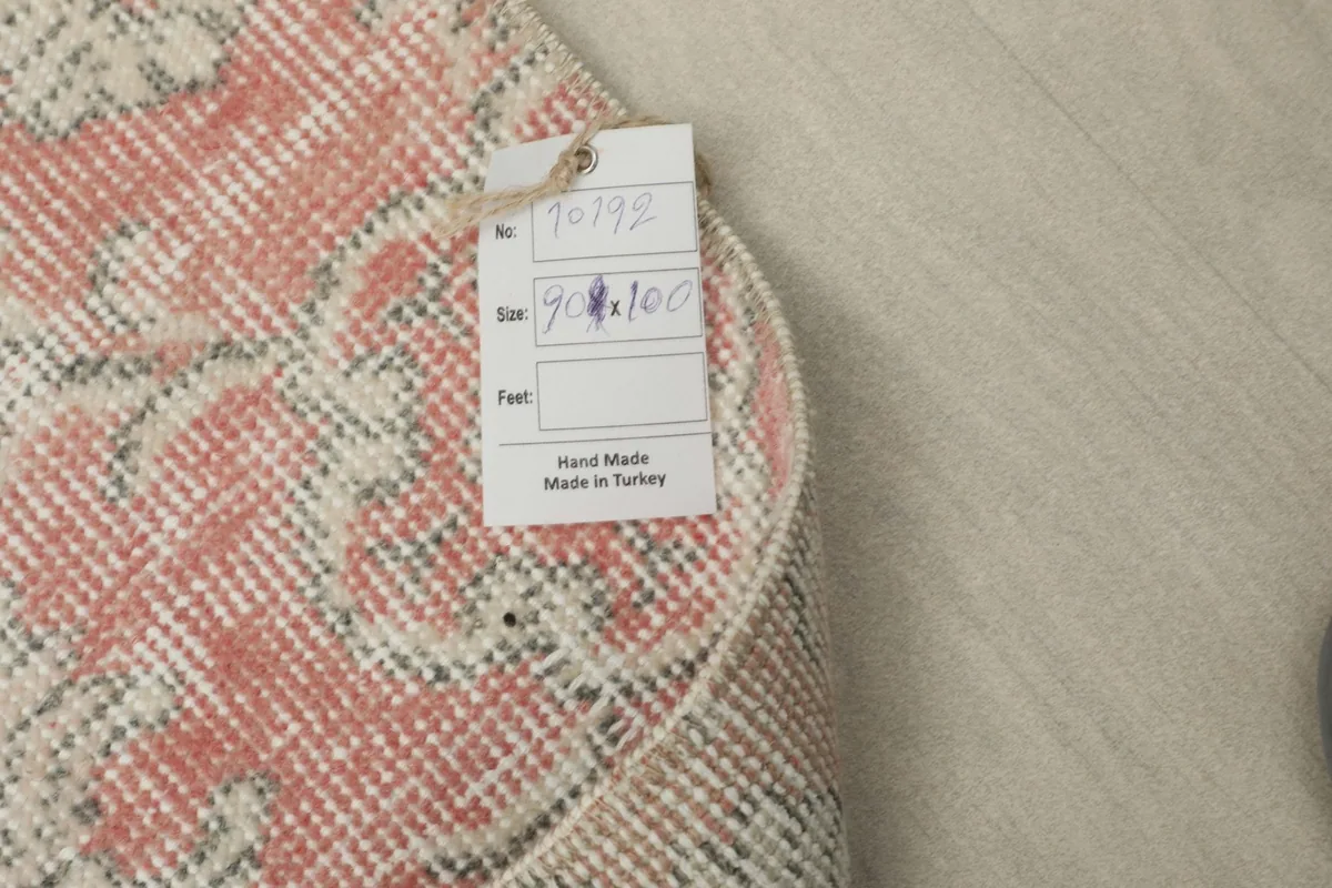 Product tag attached to the rug, displaying size and origin details