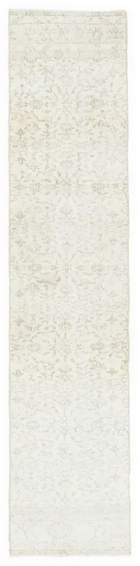 Full top view of the 2'0" x 9'9" ivory and beige vintage Anatolian runner on a white background.