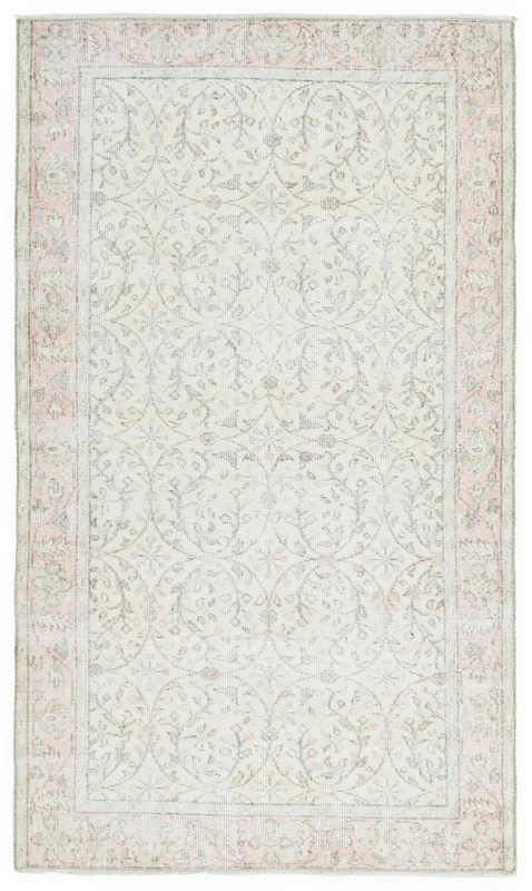 Full top view of the 3'8" x 6'5" ivory and pink vintage Anatolian rug on a white background.