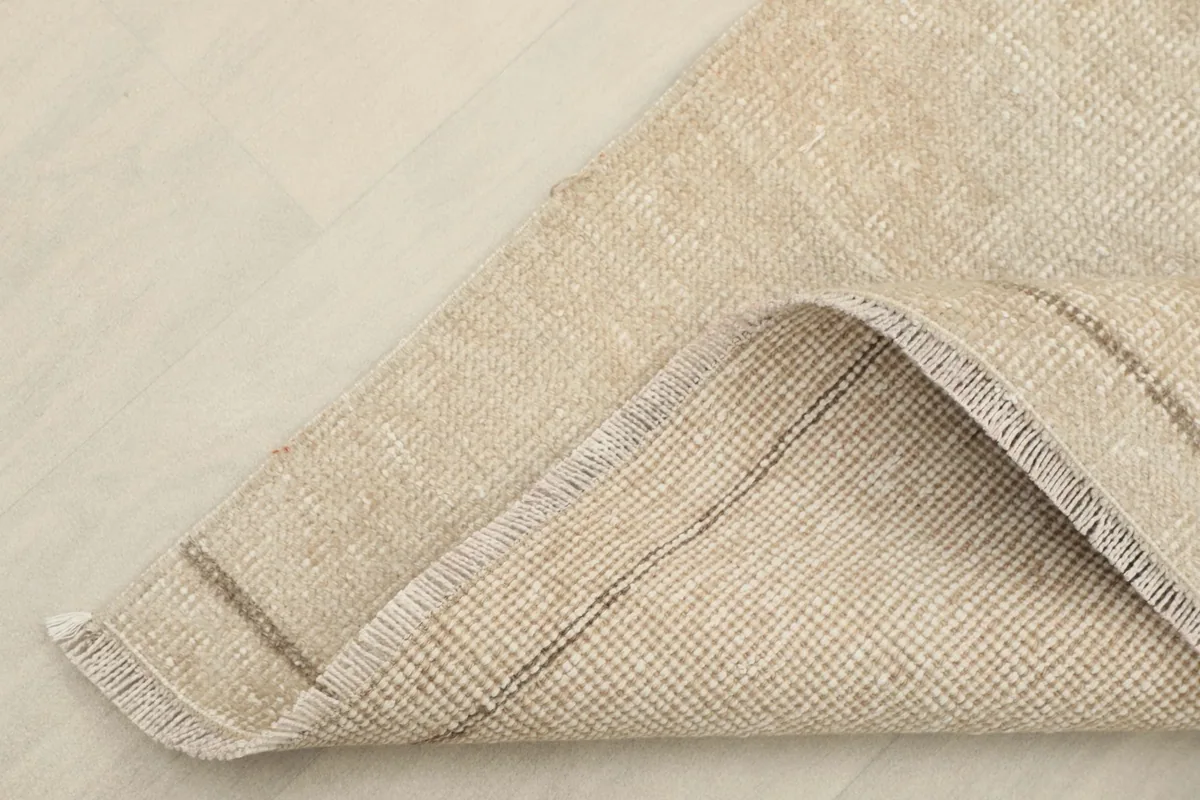 View of the cotton foundation and reverse side of the runner, showing the hand-knotted construction.
