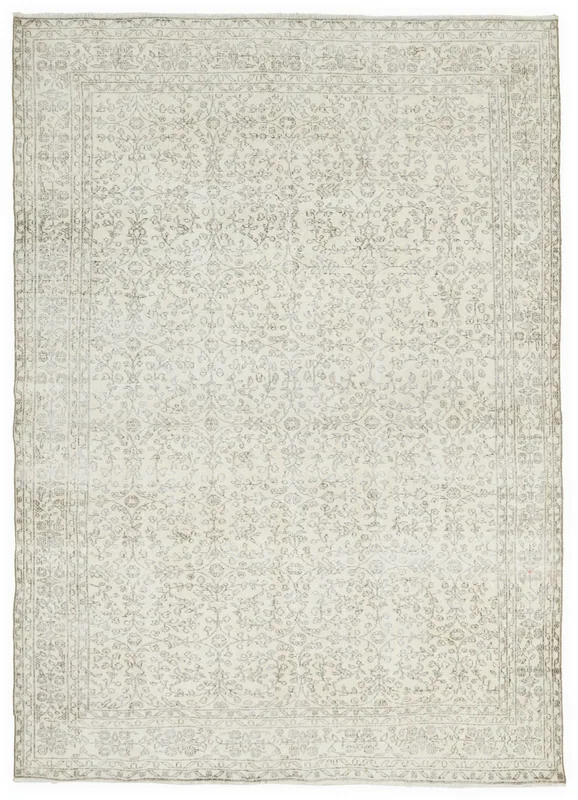 Full overhead view of the 7x10 vintage Anatolian rug with cream field and gray floral patterns.