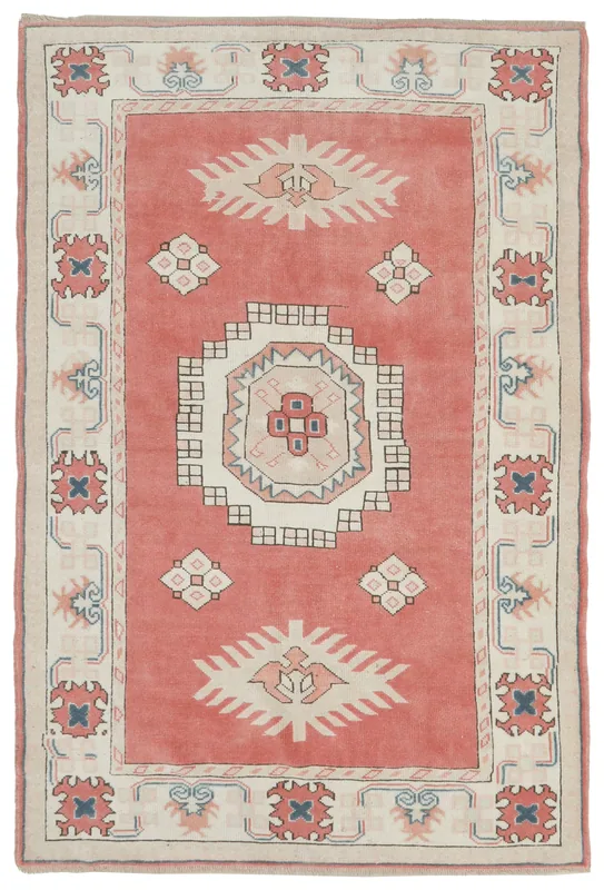 Full overhead view of the 5x8 rose tribal medallion rug on a white background