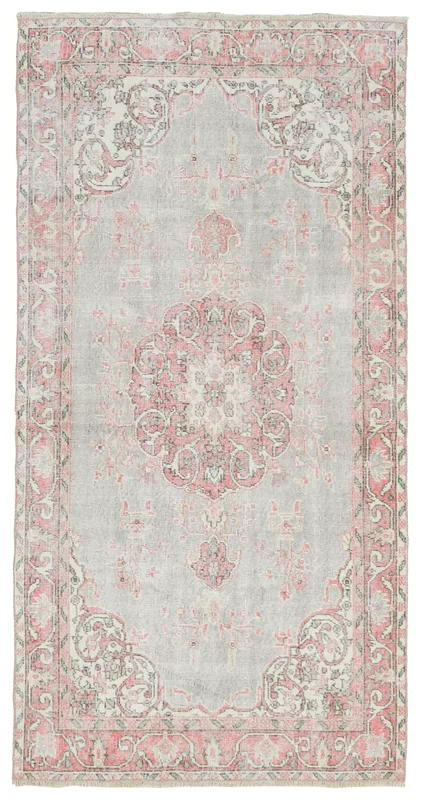 Full overhead view of the gray and rose medallion vintage Anatolian area rug.
