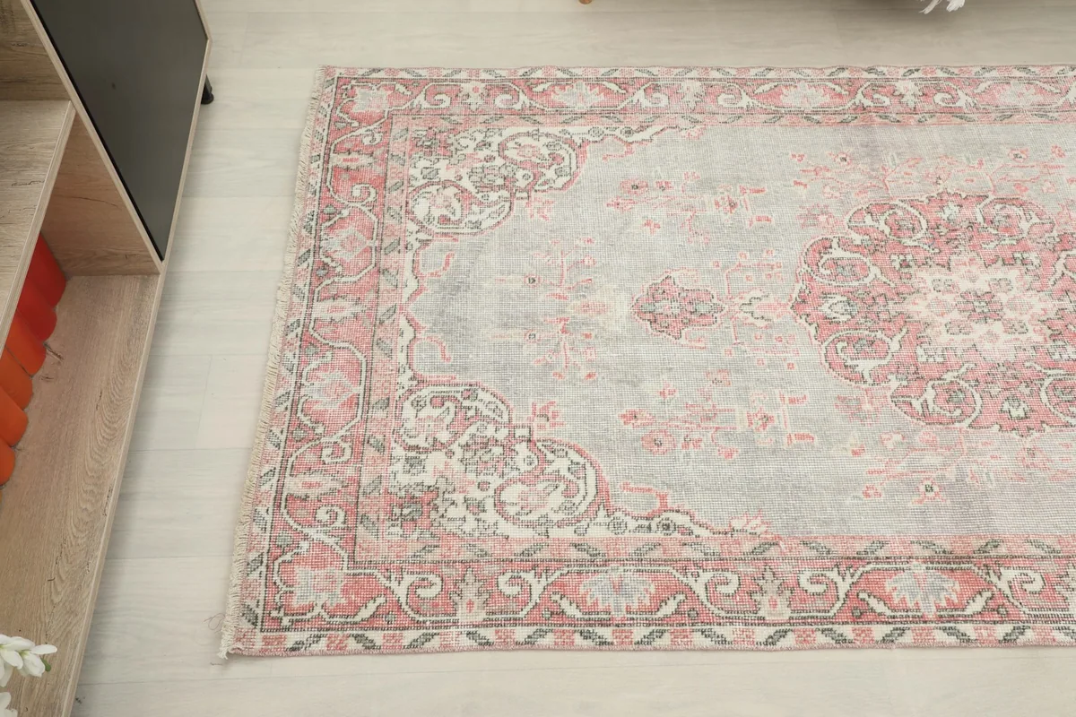 View from another angle highlighting the soft colors and intricate patterns of the rug.