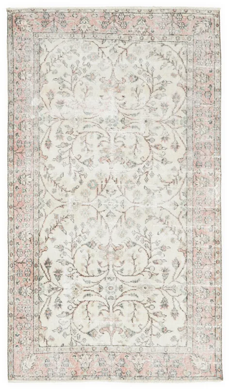 Full overhead view of the Anatolian ivory and rose floral vintage rug on a white background.