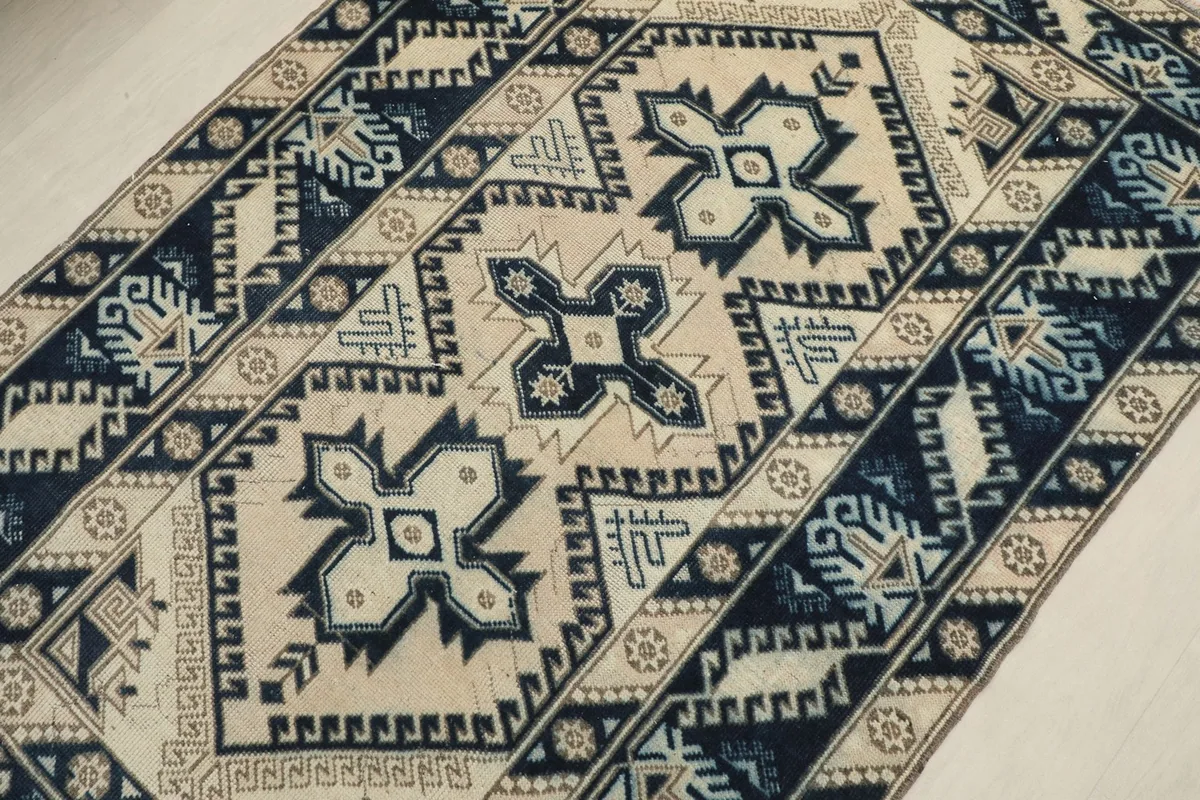 Overhead angled view of the rug, capturing the full central design and surrounding borders