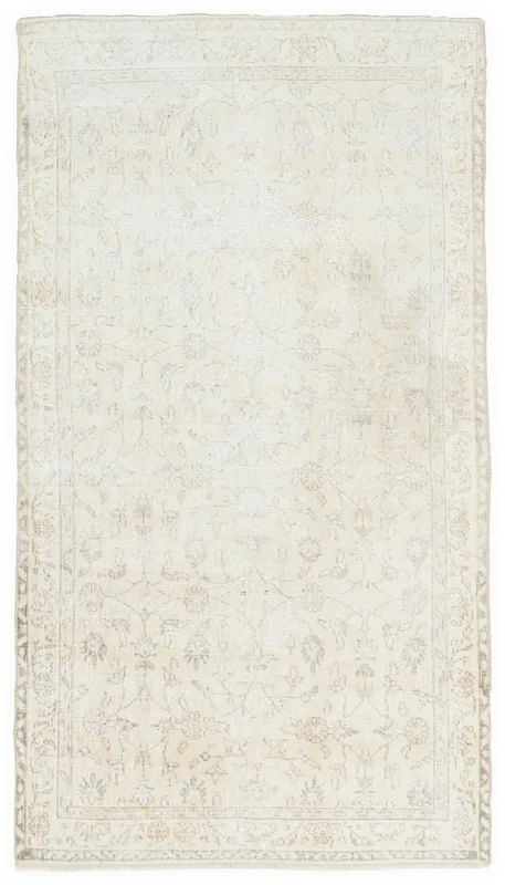 Full overhead view of the ivory and beige vintage Anatolian rug