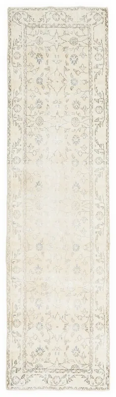 Full overhead view of the 2'8" x 9'11" cream and blue floral Anatolian runner on a white background.