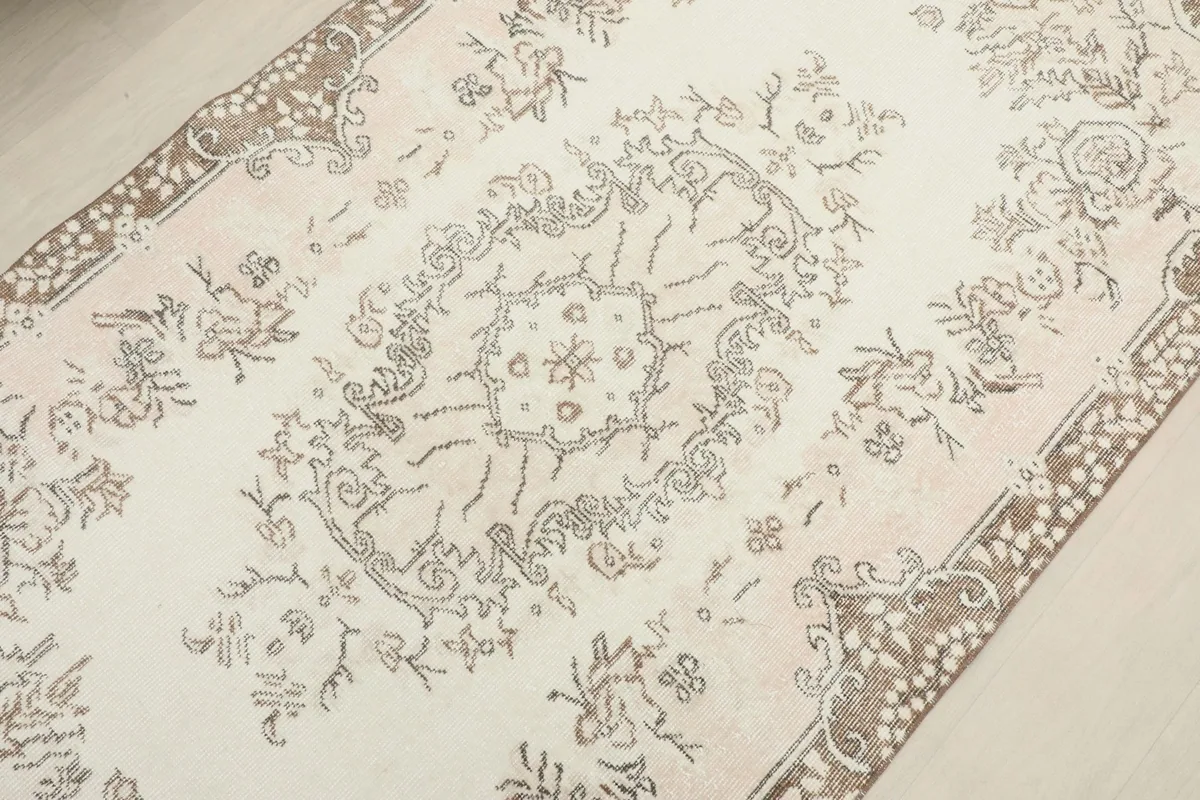 Detailed angle shot highlighting the central medallion and surrounding floral designs