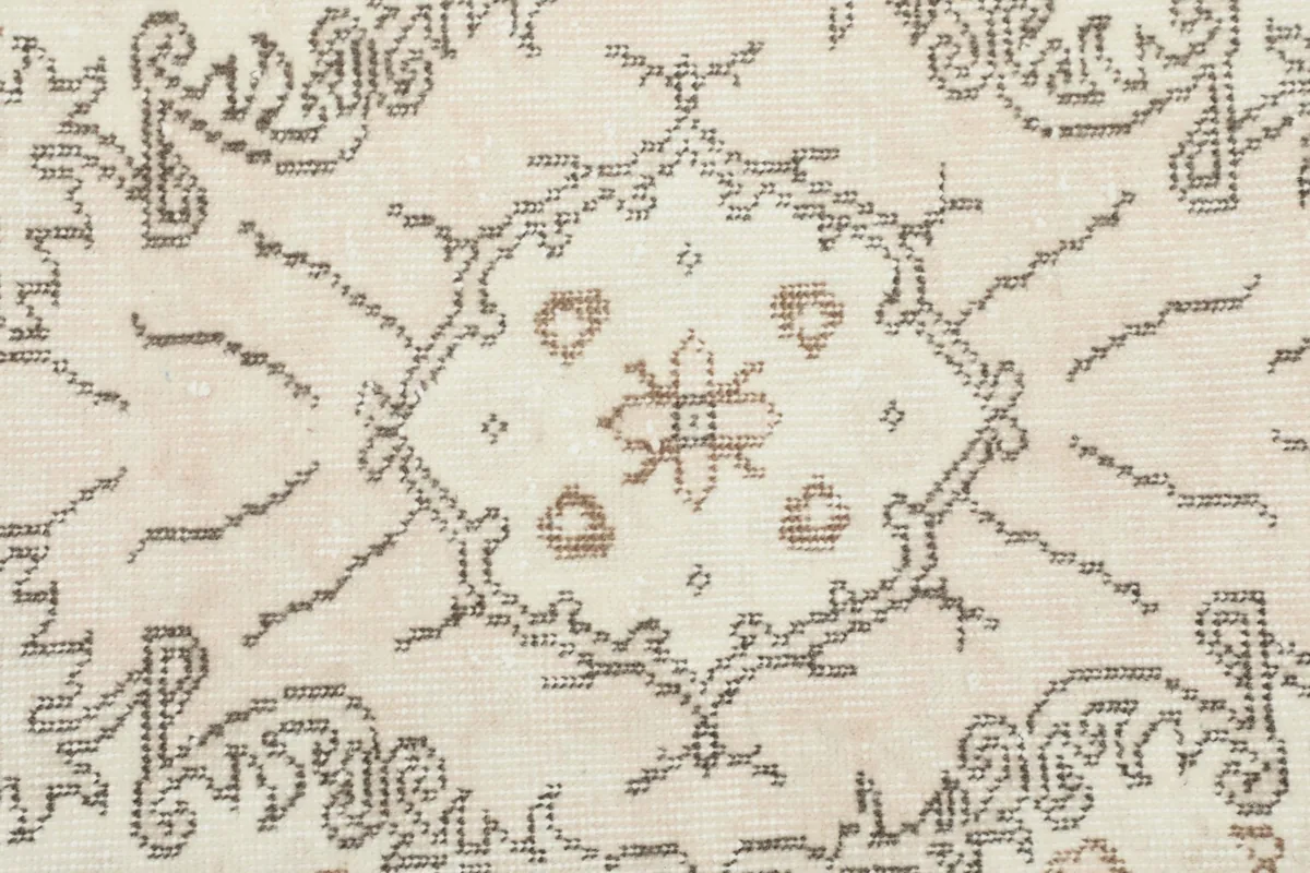 Close-up of the central medallion design, showing the intricate hand-knotted details