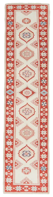 Full overhead view of the vintage Anatolian runner rug with ivory field and red border