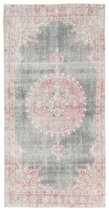 Full overhead view of a gray and pink vintage Anatolian area rug