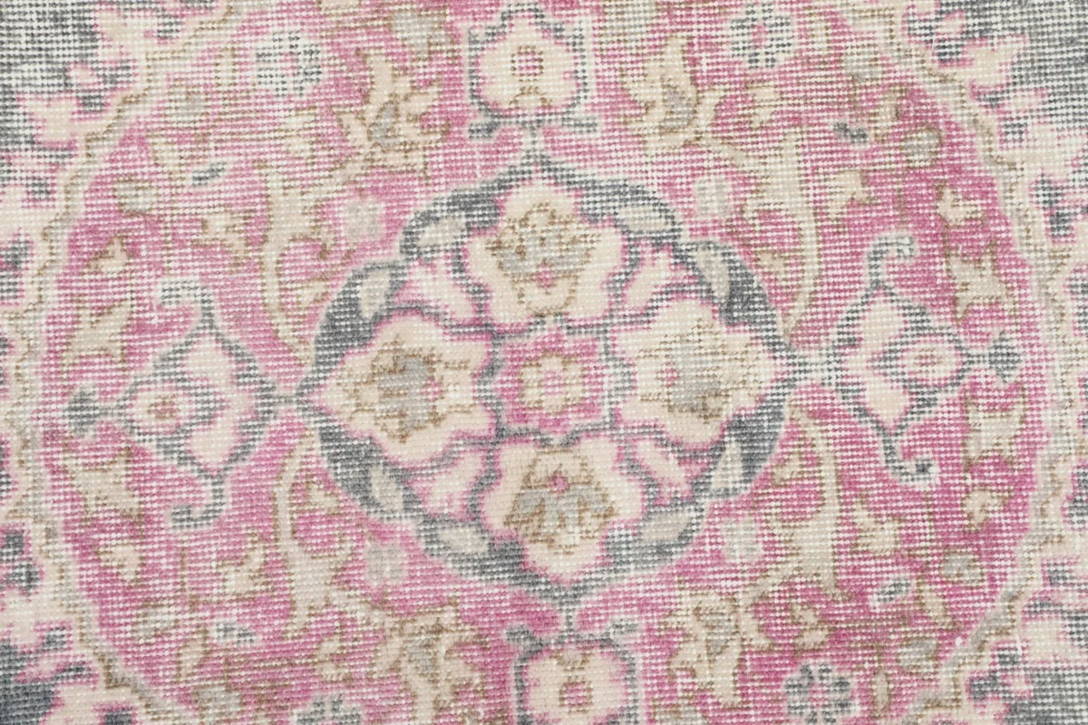 Detailed close-up of the central pink medallion with intricate patterns