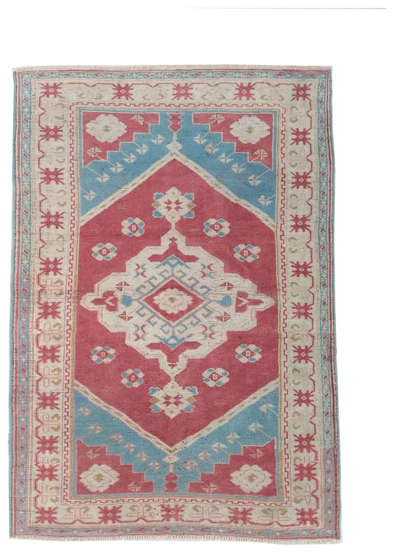 Full top view of the vintage Anatolian rug with red, blue, and beige geometric patterns on a white background.