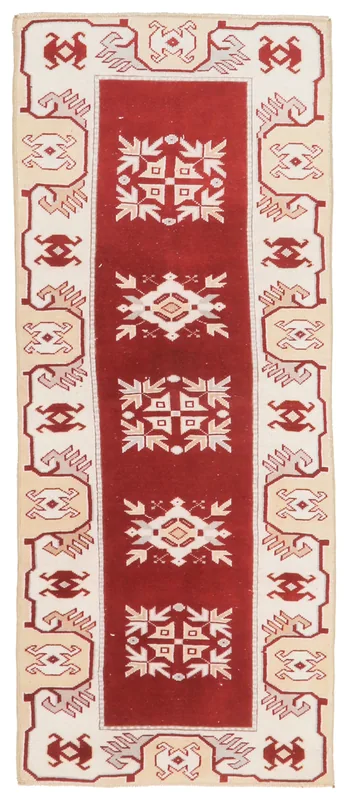 Full top view of the vintage Anatolian runner with a red field and geometric motifs.