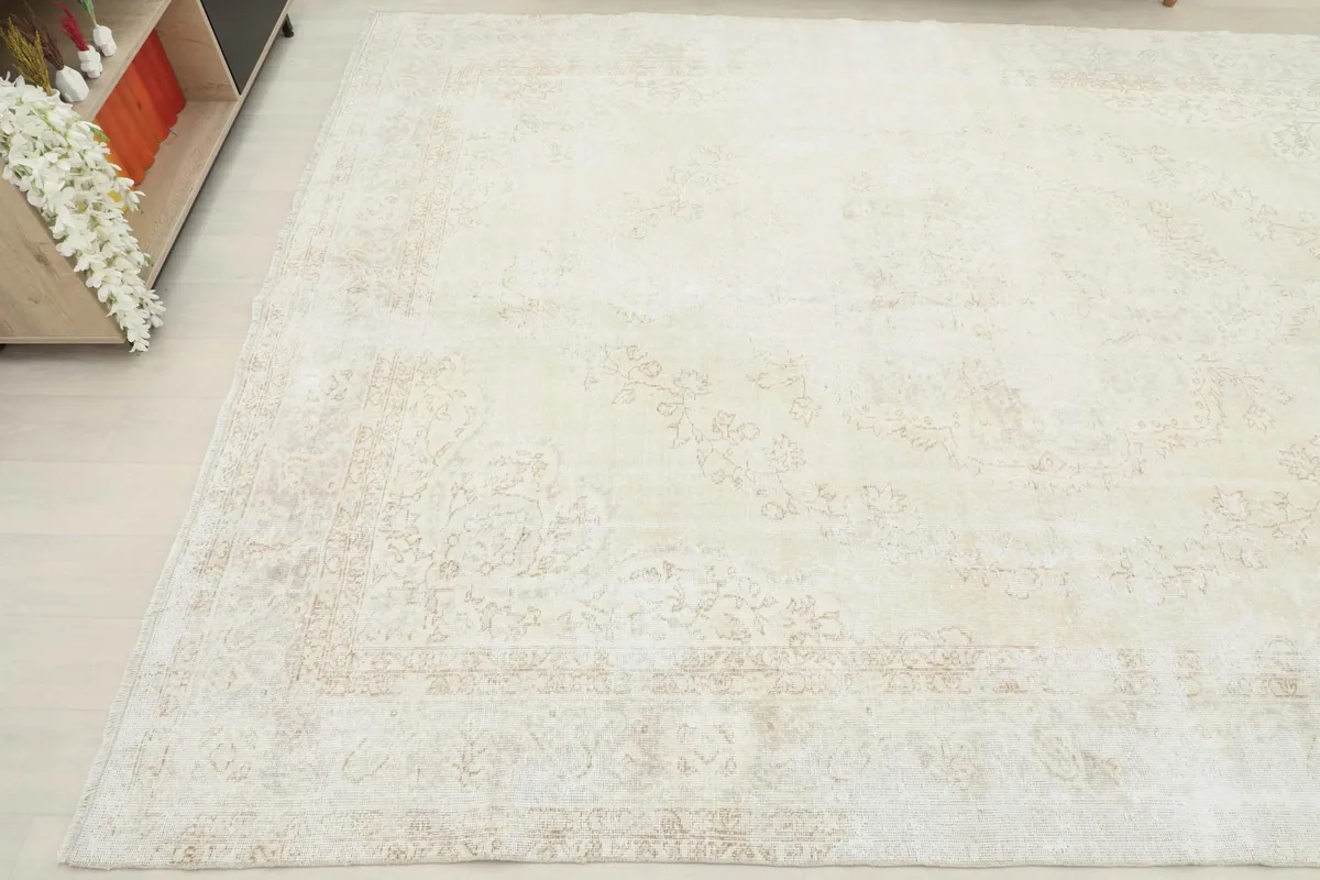 Angled view of the rug from another corner, emphasizing the overall soft patina and texture