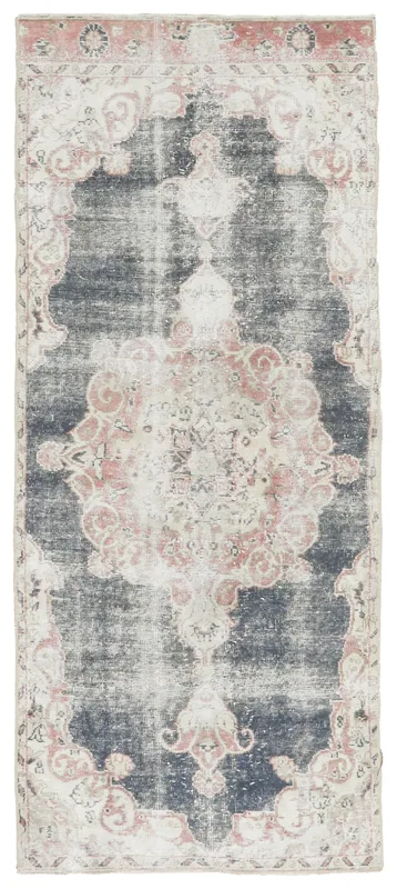 Full overhead view of the navy and rose vintage Anatolian runner on a white background
