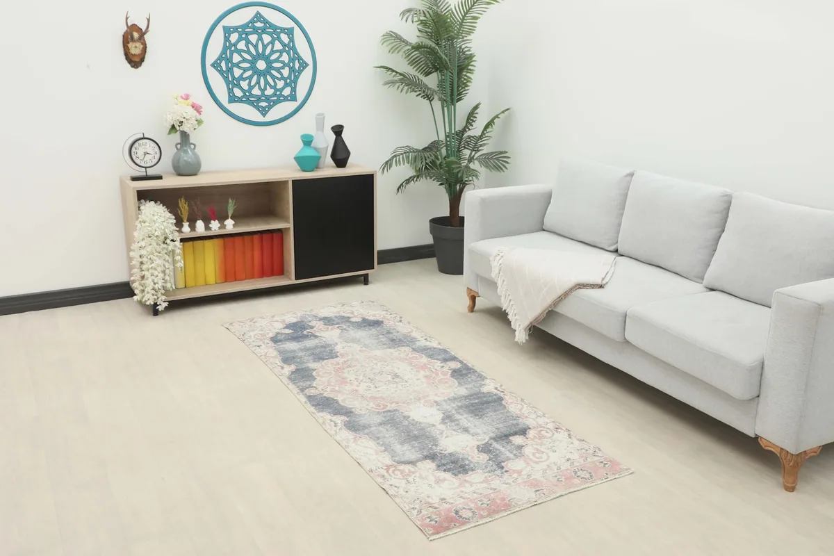 Runner placed in a modern living room setting with a light gray sofa and wooden cabinet