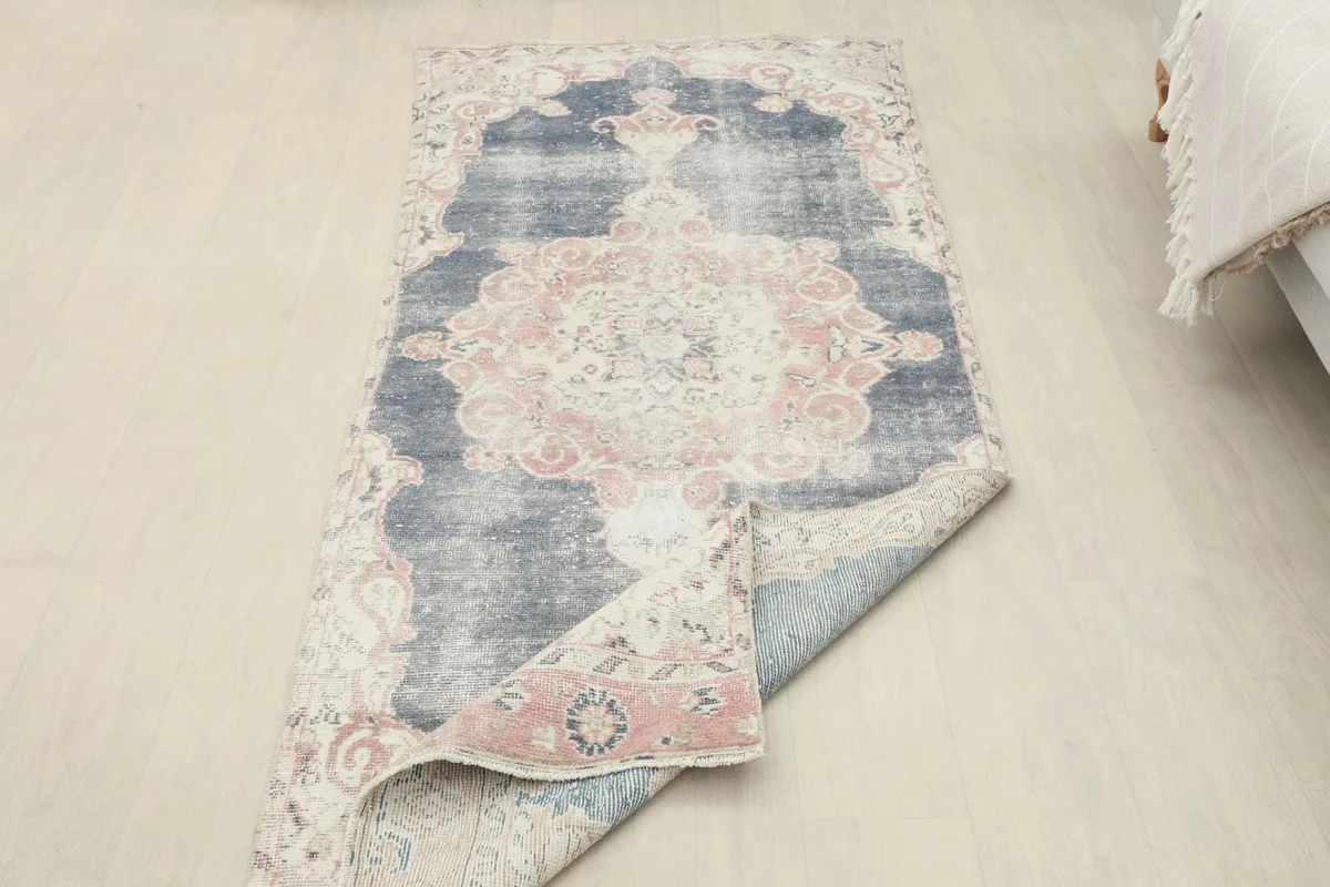 Runner partially folded to show the flexibility and thickness of the wool pile