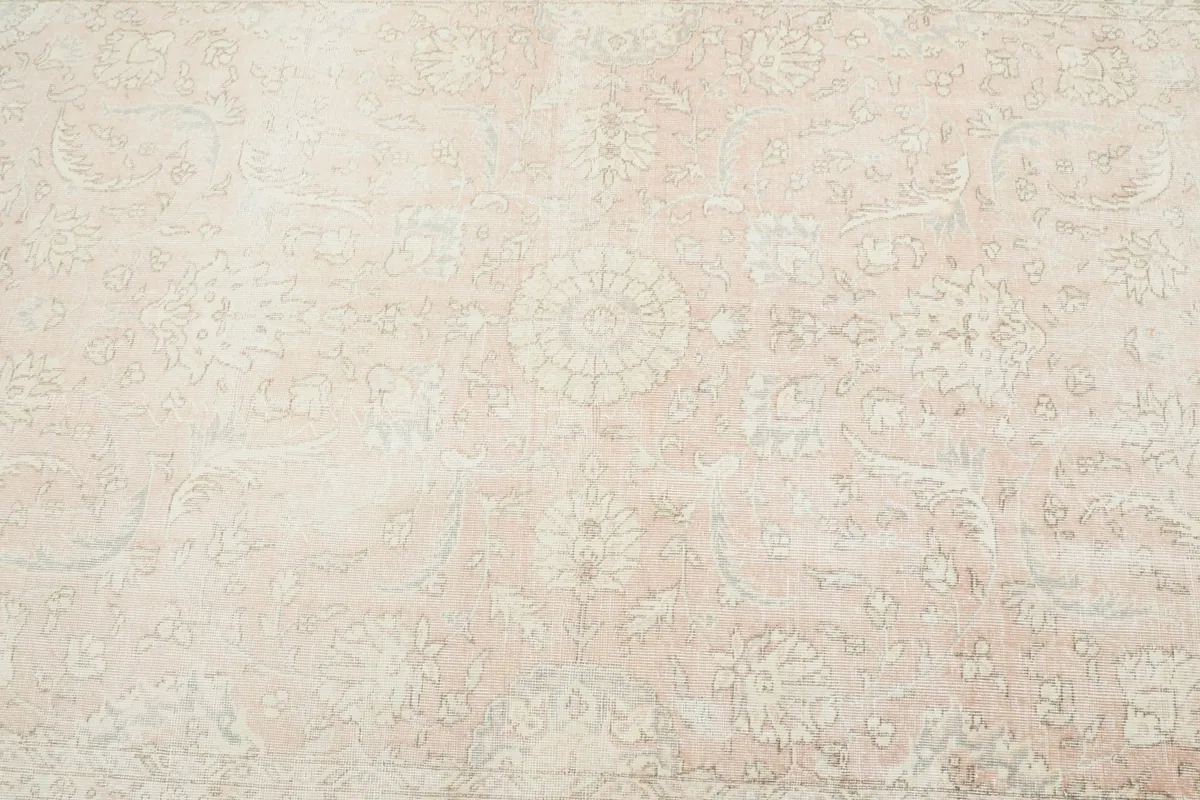 Detailed overhead view of the rug's center, revealing intricate floral and geometric designs