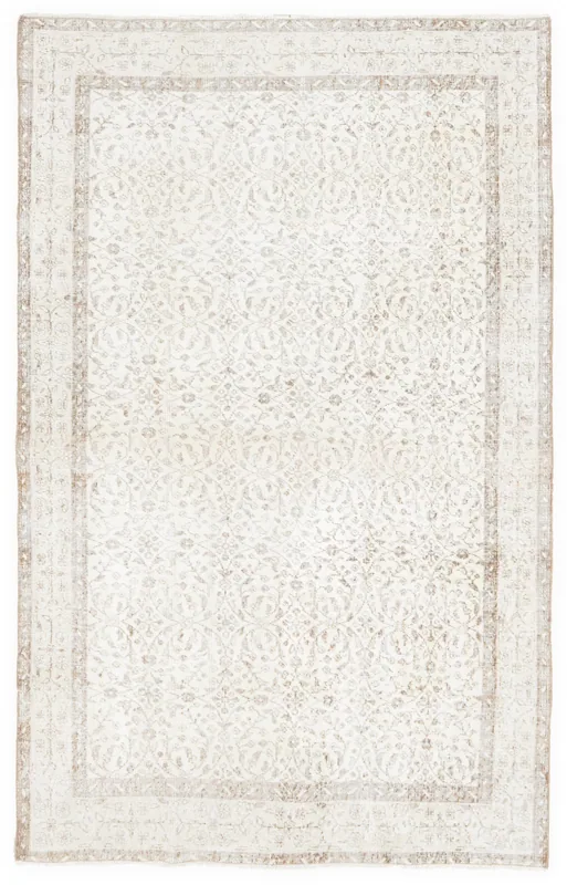 Full overhead view of the 5x8 ivory and beige floral vintage Anatolian area rug