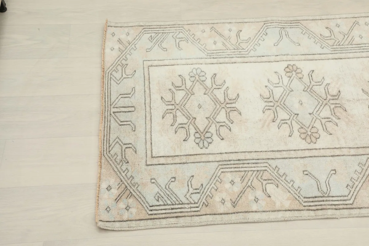 Close-up of the upper left corner highlighting the charcoal tribal patterns