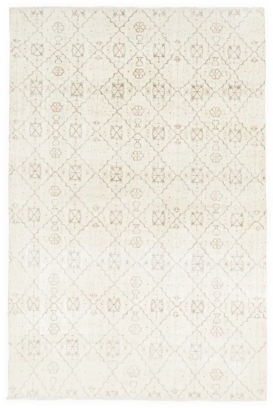 Full overhead view of the ivory floral geometric vintage rug