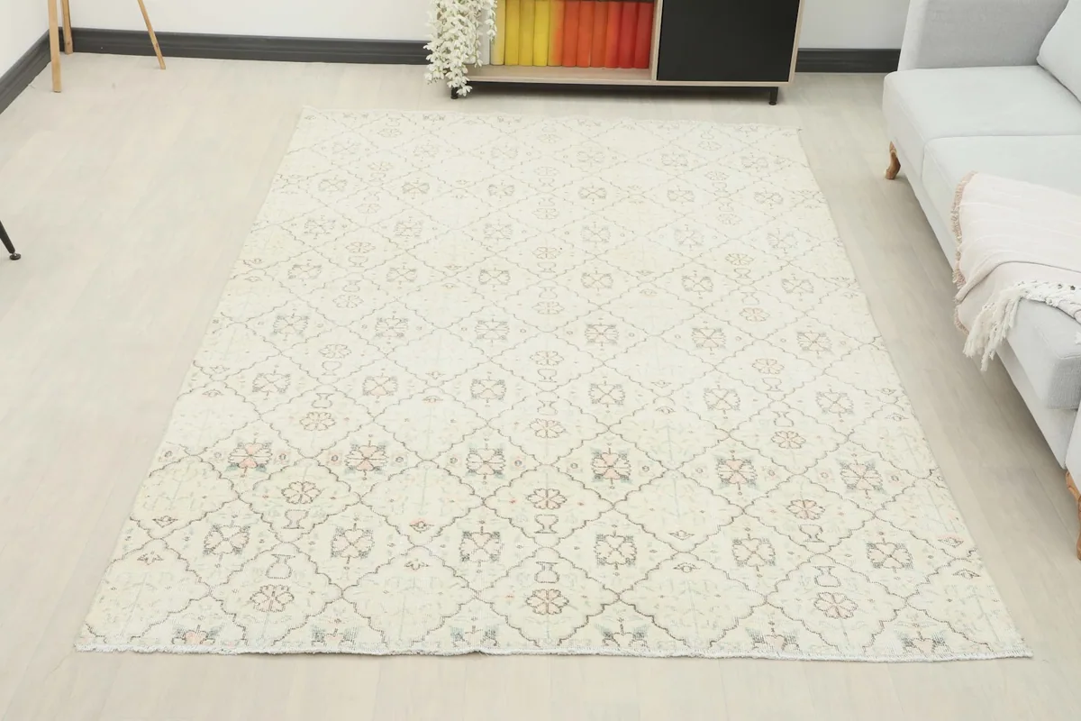 Full room view of the ivory rug complementing the light decor and furniture