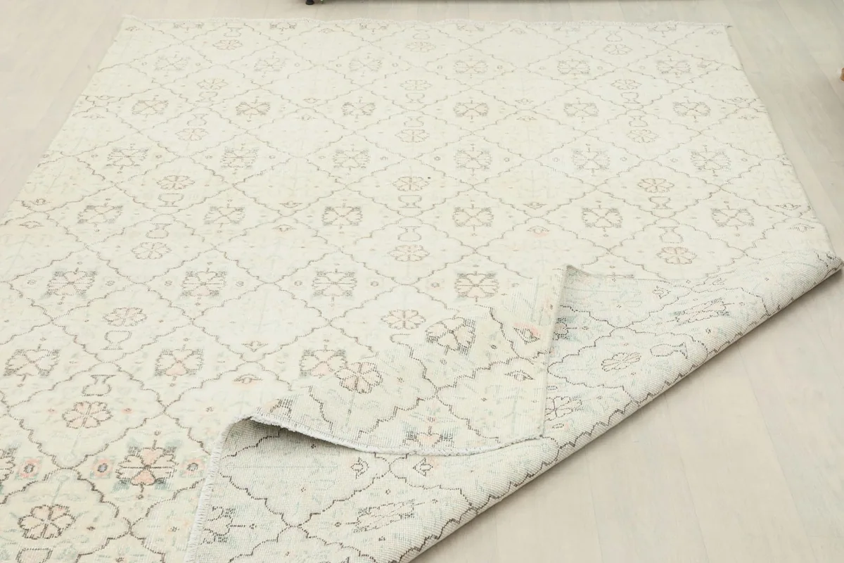 Rug corner folded, showing the flexibility and construction of the vintage piece