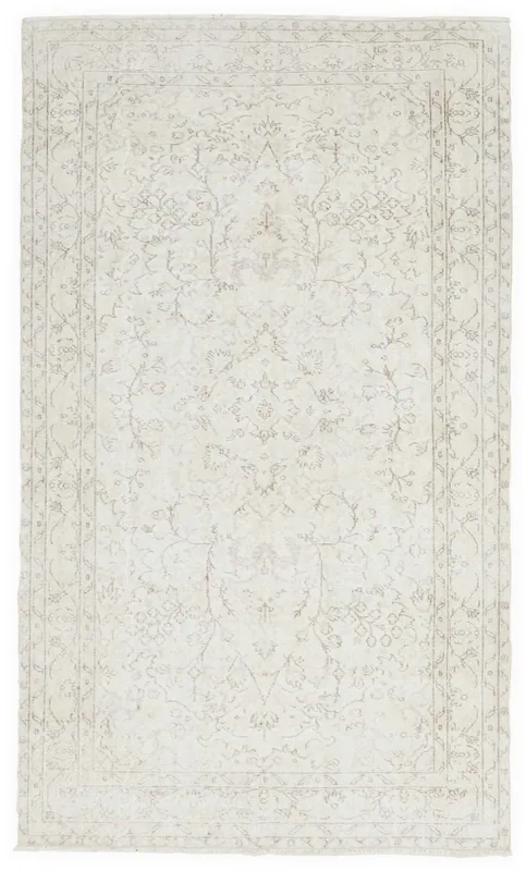 Full overhead view of the 5x9 ivory distressed floral vintage Anatolian rug on a white background.