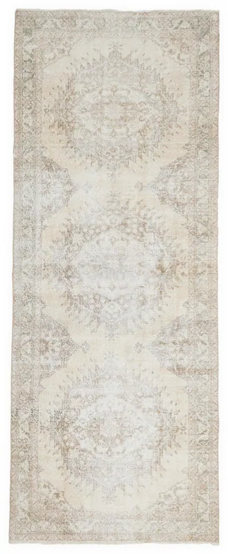 Full overhead view of the vintage Anatolian runner rug with ivory and beige tones
