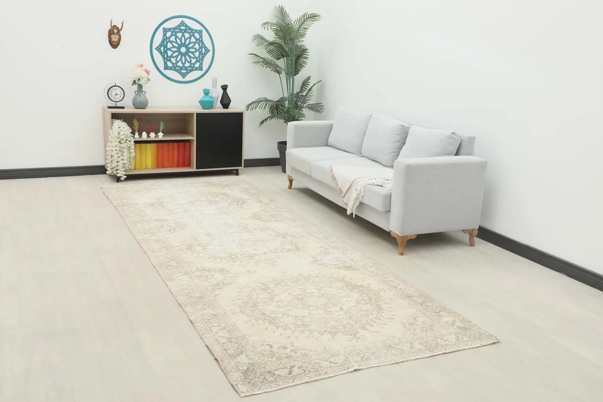 Runner rug displayed in a living room setting, complementing a light-colored couch