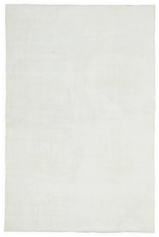 Full overhead view of the 6'9" x 10'1" cream minimalist vintage Anatolian rug on a white background.