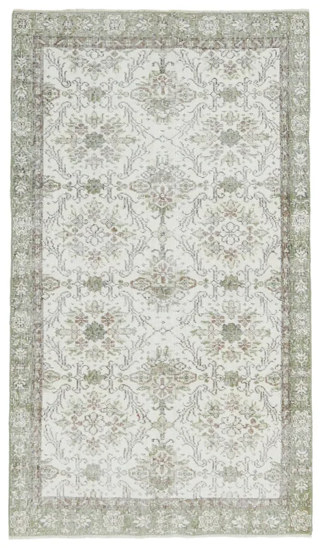 Full overhead view of the 3'8" x 6'5" cream and green floral Anatolian vintage rug on a white background
