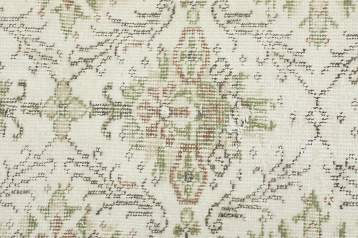 Detailed close-up of the low wool pile, revealing the hand-knotted texture and aged patina of the fibers