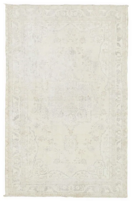 Full top view of the 5'1" x 8'7" cream vintage Anatolian area rug with subtle faded patterns.