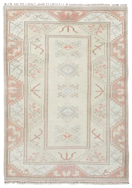 Full overhead view of the 6'7" x 9'3" ivory and rose vintage Anatolian rug