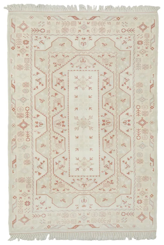 Full overhead view of a vintage cream and rust geometric Anatolian area rug