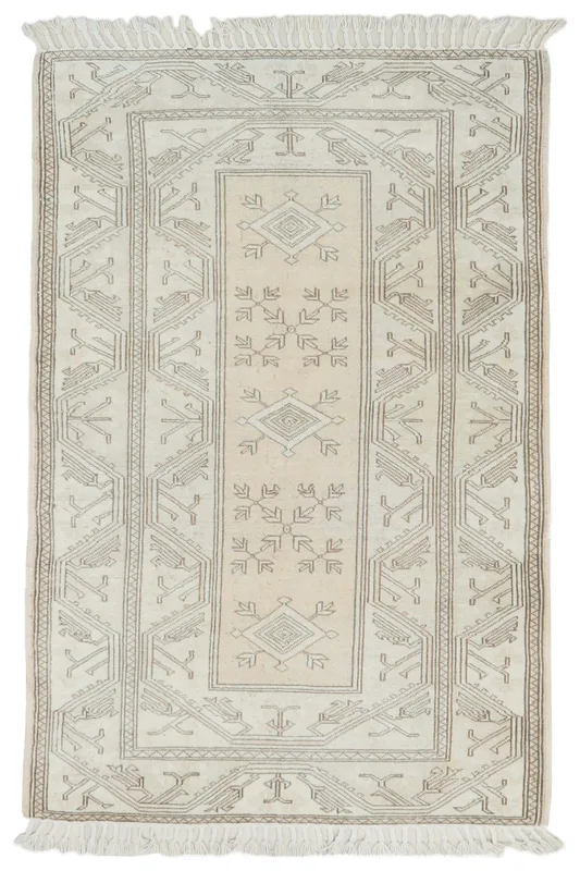 Full overhead view of the beige and gray geometric Anatolian rug