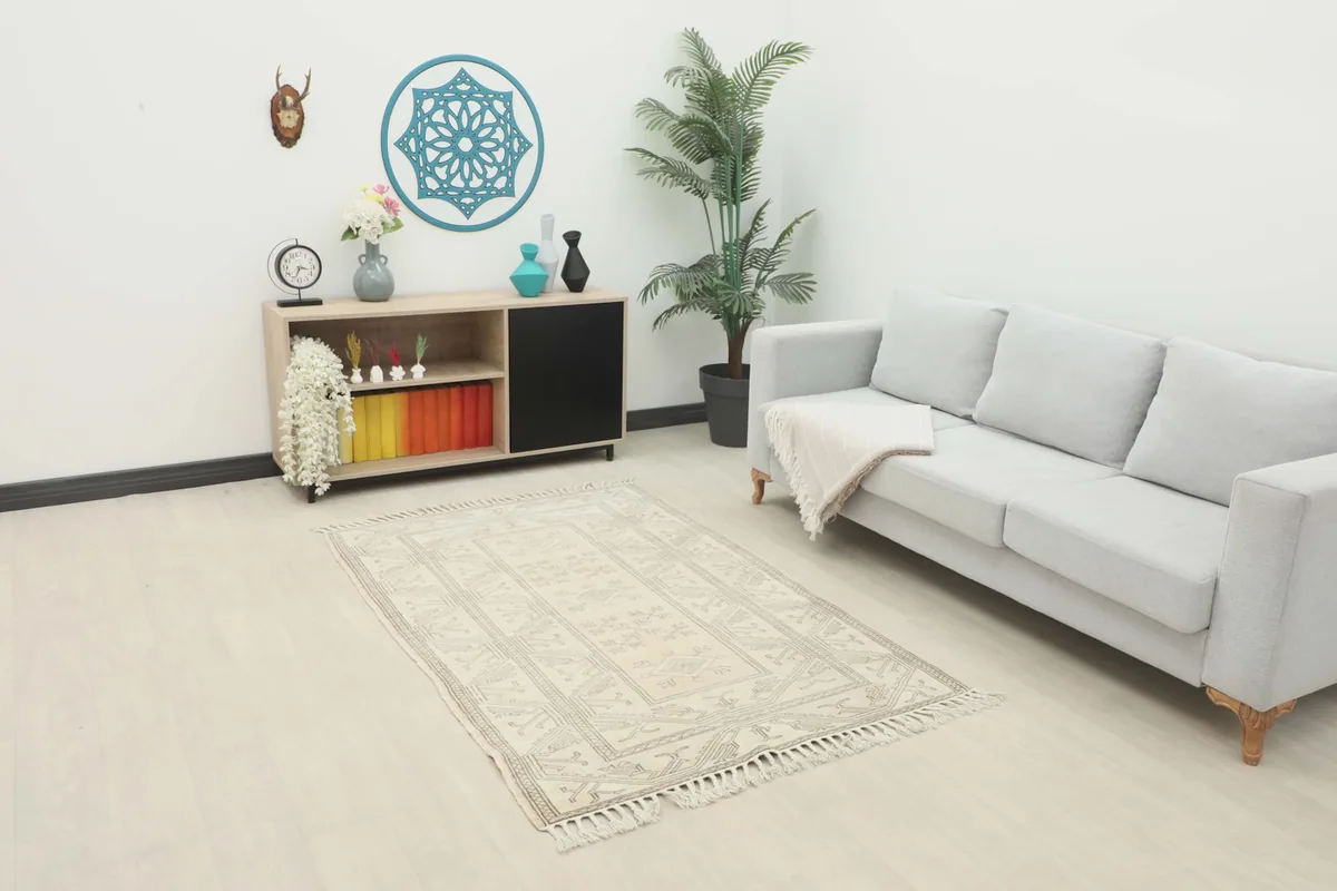 Beige and gray vintage rug placed in a modern living room setting