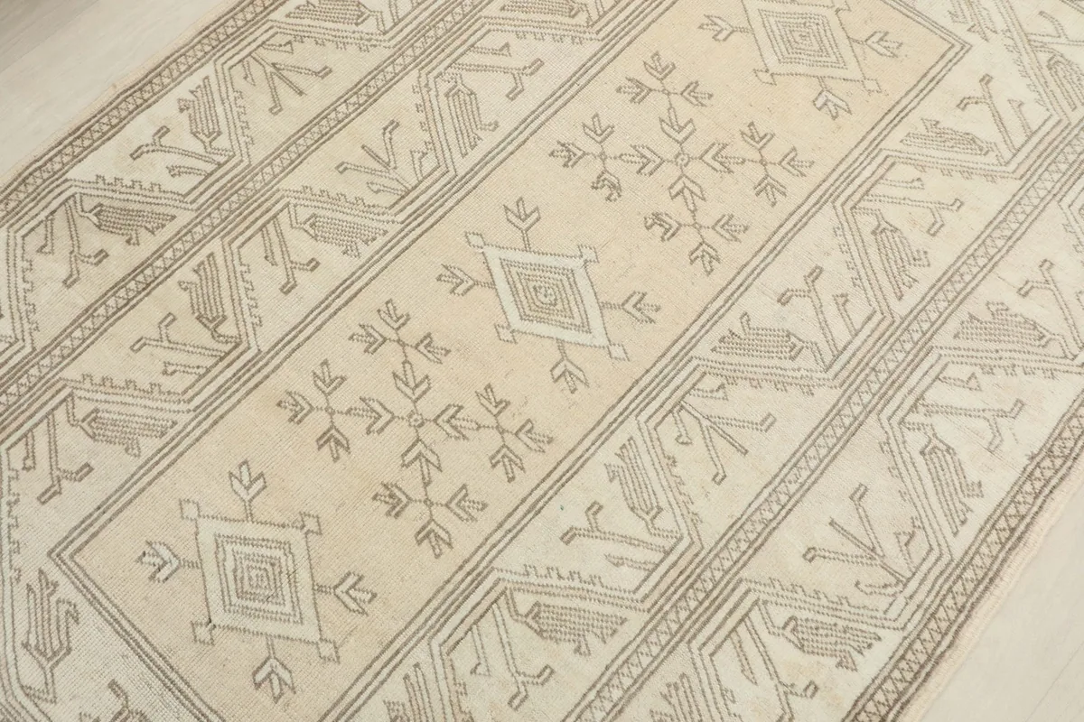 Overhead view focusing on the central geometric motifs and muted colors