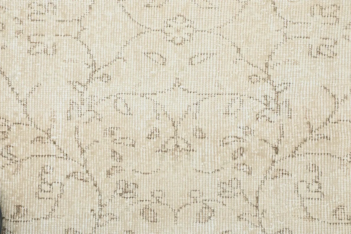 Detailed view of the hand-knotted wool pile and intricate patterns
