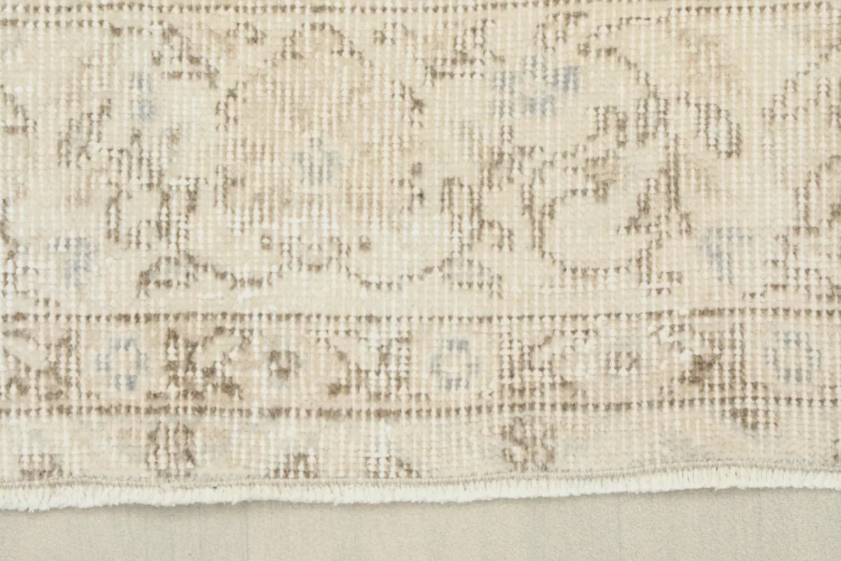 Close-up of the border design and edge of the vintage rug