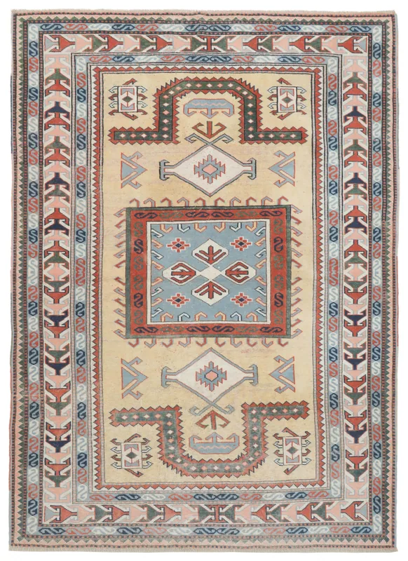 Full top view of the beige Anatolian vintage rug on a white background, showcasing its geometric patterns.