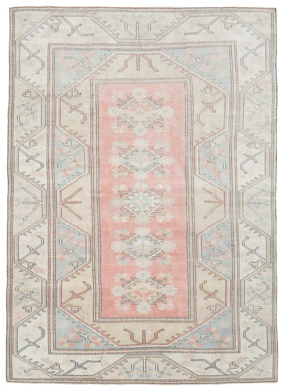 Full top view of the 6'4" x 8'11" vintage Anatolian area rug with rose, blue, and beige colors