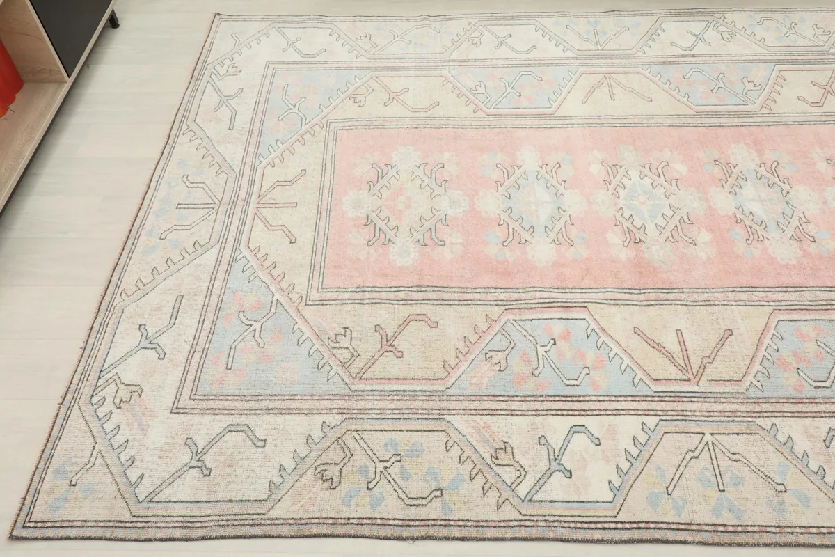 Another angled view of the area rug, showcasing the full pattern and color distribution